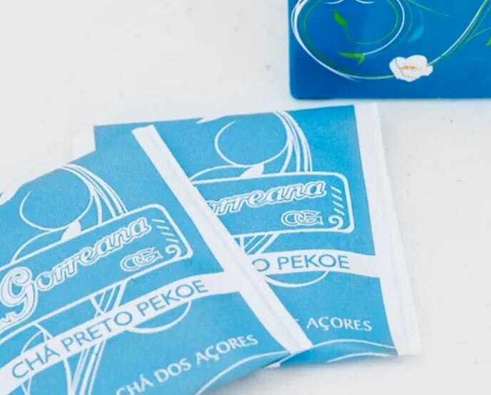 Gorreana Chá Preto Pekoe tea bags with blue packaging on a white surface