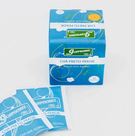 Blue Gorreana Chá Preto Pekoe black tea box and two tea sachets on white background