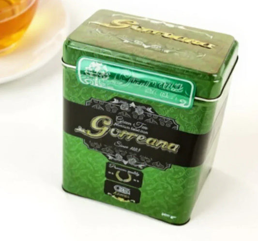 Green metal tin of Gorreana organic green tea with black label and floral design on white background